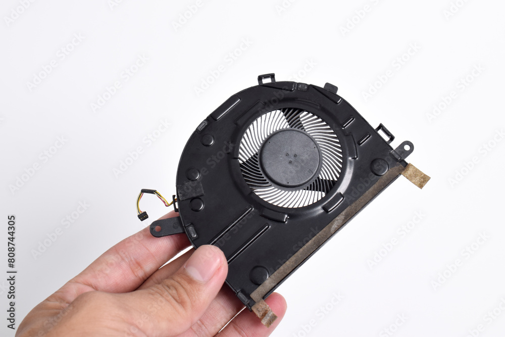 Hand holding Cooling system for laptop or notebook isolated on white background. CPU cooler for laptop Hand holding Cooling system for laptop or notebook isolated on white background. CPU cooler for laptop