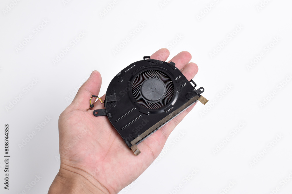 Hand holding Cooling system for laptop or notebook isolated on white background. CPU cooler for laptop Hand holding Cooling system for laptop or notebook isolated on white background. CPU cooler for laptop