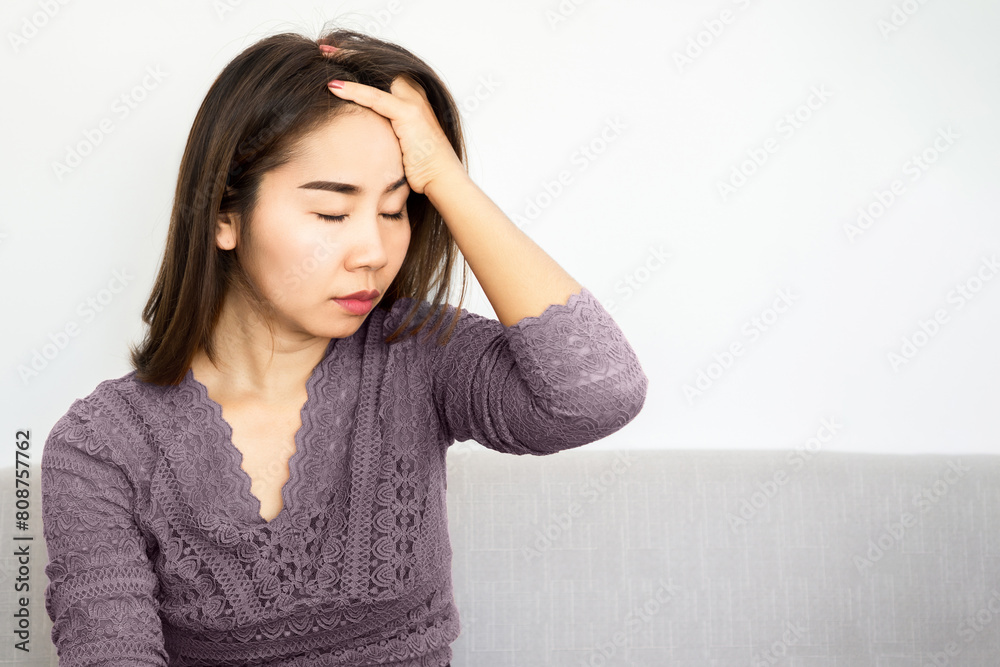 stress asian woman suffering from headache one side ,on the left side stress asian woman suffering from headache one side ,on the left side