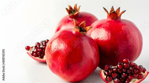 Close up of fresh Pomegranates on a white Background