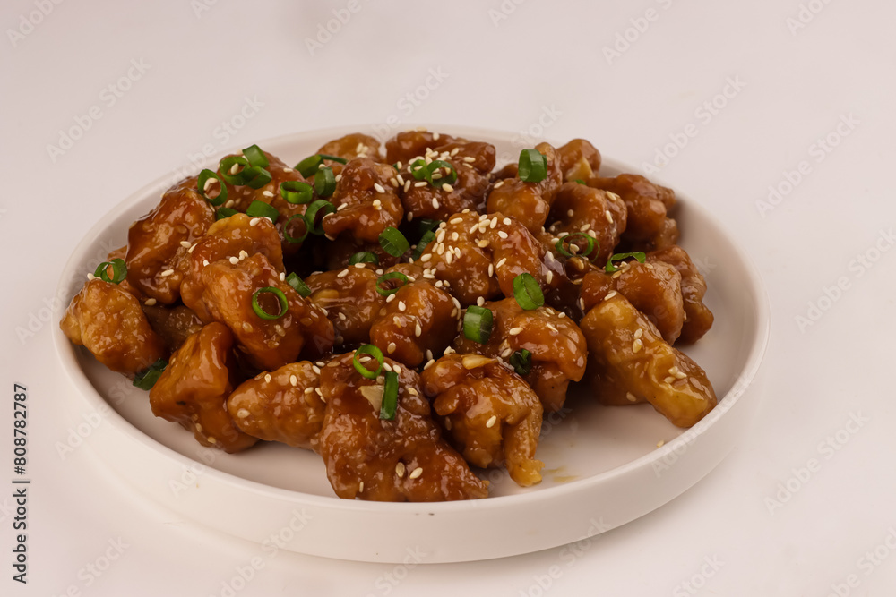 General Tso's Chicken is a Perfect Combination of Sweet, Savoury, Spicy and Tangy with Crispy Chinese Chicken Bites. General Tso's Chicken is a Perfect Combination of Sweet, Savoury, Spicy and Tangy with Crispy Chinese Chicken Bites.