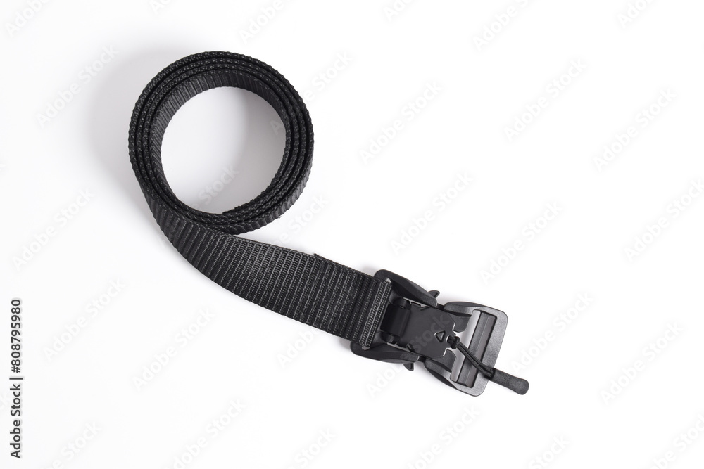 Black mens nylon fastening belt isolated on white background. Men's outdoor military tactical belt. Black mens nylon fastening belt isolated on white background. Men's outdoor military tactical belt.