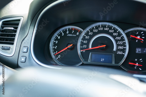 Closeup of a speedometer in a modern car, shallow depth of field photo