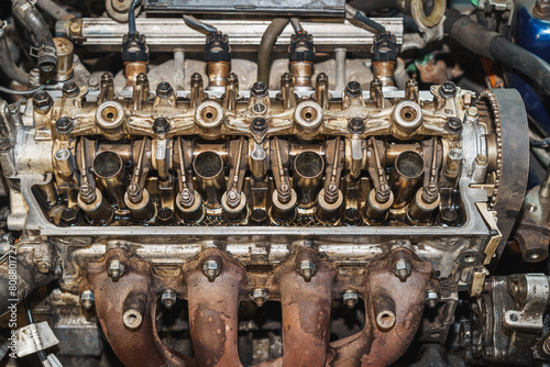 Top view of a car engine. Cylinder heads. Valves. Valve springs. Sixteen valves. Camshaft. Rocker arm. Rocker shaft. Engine block. Auto service. Car repair.	