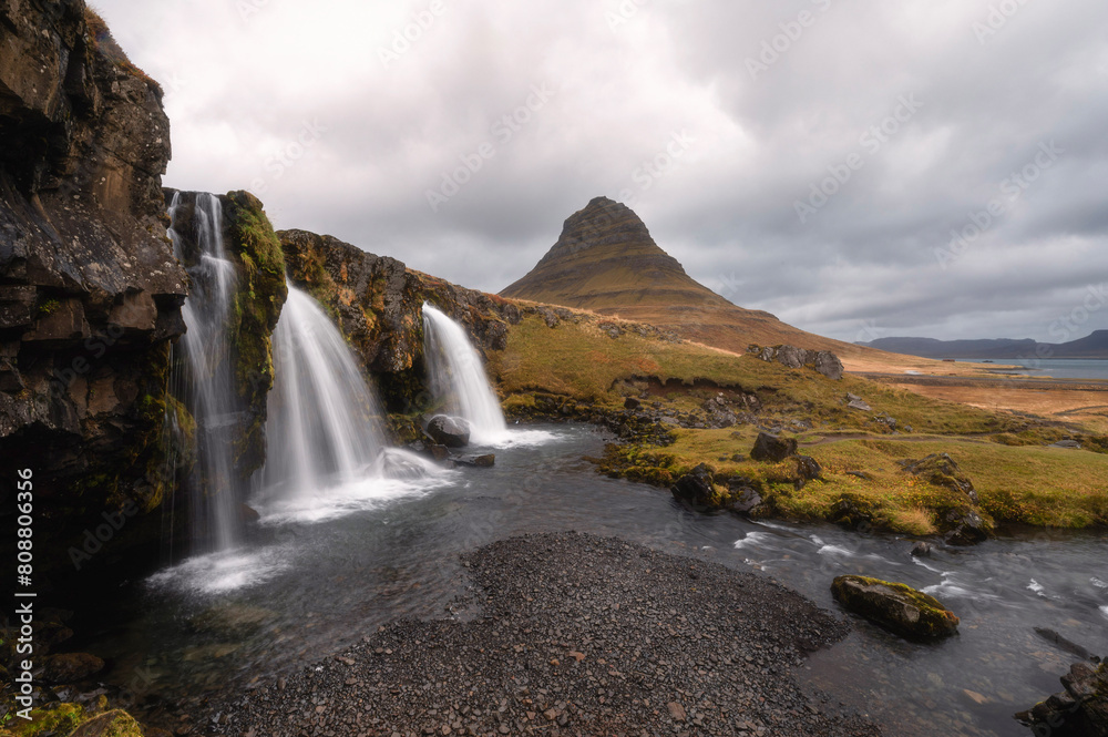 Kirkjufells and Kirkjufellsfossar in Autumn, Snaefellsnes, Iceland Kirkjufells and Kirkjufellsfossar in Autumn, Snaefellsnes, Iceland