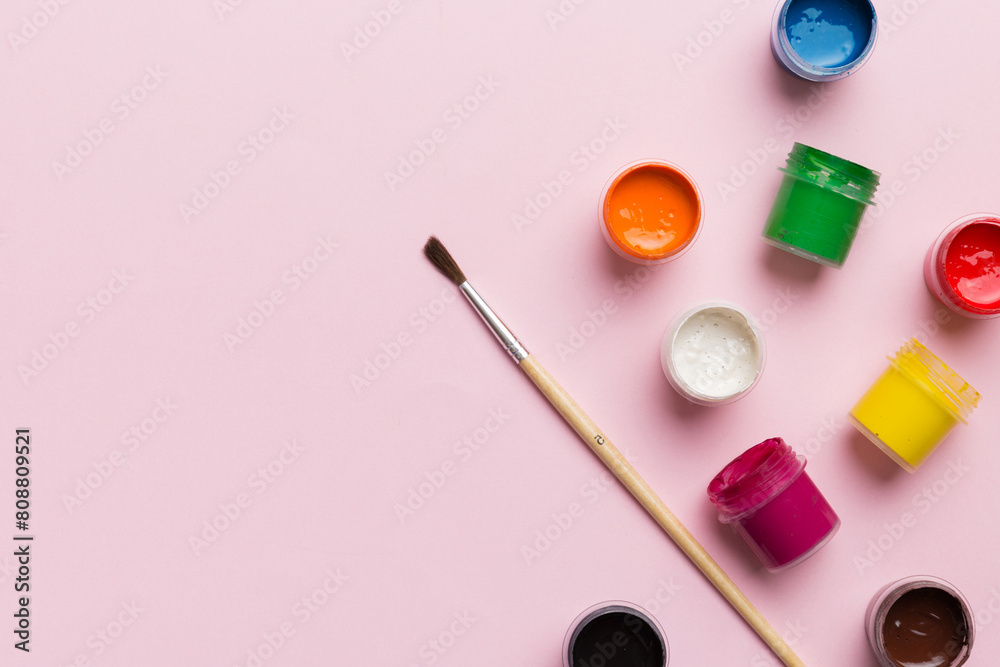 art palette with paint and brushes, close up. Top view with empty space. workplace for creativity. home teaching concept drawing art palette with paint and brushes, close up. Top view with empty space. workplace for creativity. home teaching concept drawing