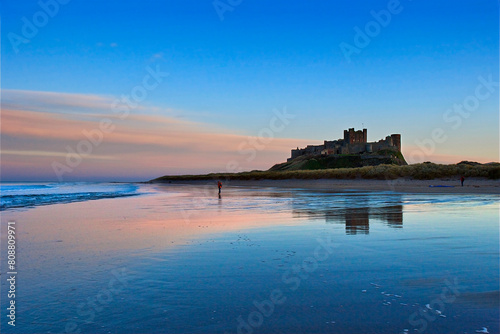 Sunset on Bamburgh Castle  on the northeast coast of England  by the village of Bamburgh in Northumberland