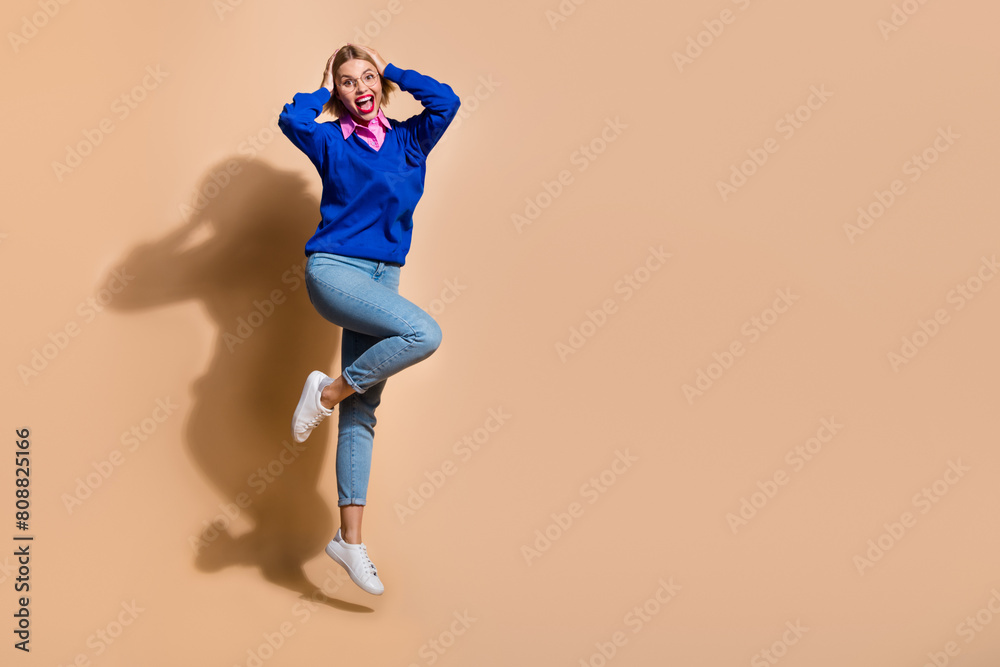 Full body length photo of astonished business lady young age model touch head near billboard news isolated on beige color background Full body length photo of astonished business lady young age model touch head near billboard news isolated on beige color background