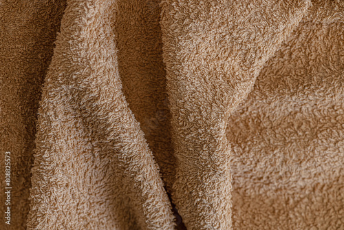 abstract background of beige terry towel texture close up shallow depth of field