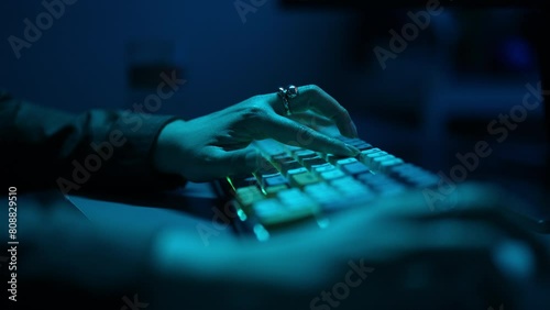 Extreme close-up of unrecognizable female hacker using computer breaks into government data servers and infects their systems with virus. Security password login technology business concept.