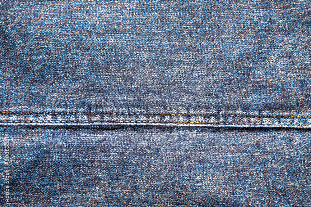 texture of blue jeans denim fabric with seam background texture of blue jeans denim fabric with seam background