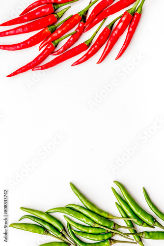 Fresh red and green chilli pepper pattern on white table background top view mockup