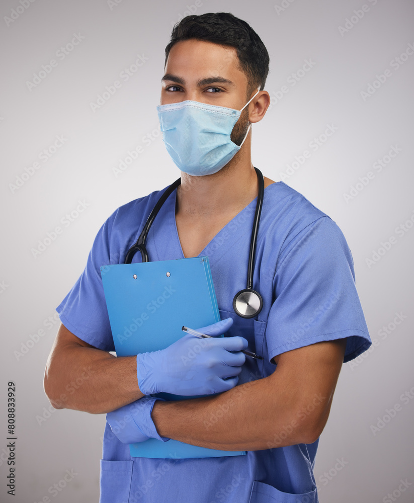 Studio, man or nurse in portrait with clipboard for patient documents, notes or info by white background. Male surgeon, face mask or gloves for bacteria, virus or illness protection with regulations Studio, man or nurse in portrait with clipboard for patient documents, notes or info by white background. Male surgeon, face mask or gloves for bacteria, virus or illness protection with regulations
