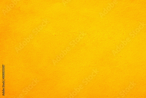 Vibrant Yellow Cement Wall Texture Background for Design Projects