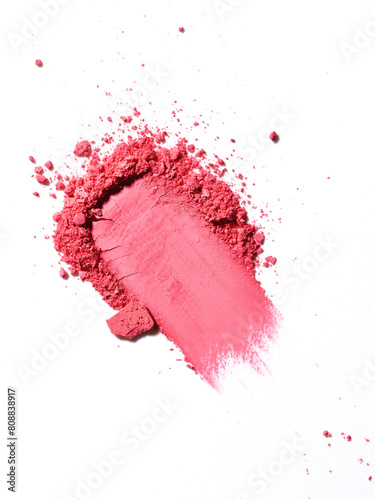 Swatch or swoosh of red makeup powder texture. Bold smear or sample of cosmetic product. Macro image of make-up texture in super high resolution.