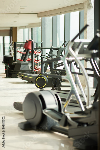 Modern Fitness Center- Bright, spacious gym with cardio machines and natural light