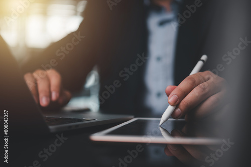 businessman using stylus pen working on a digital tablet