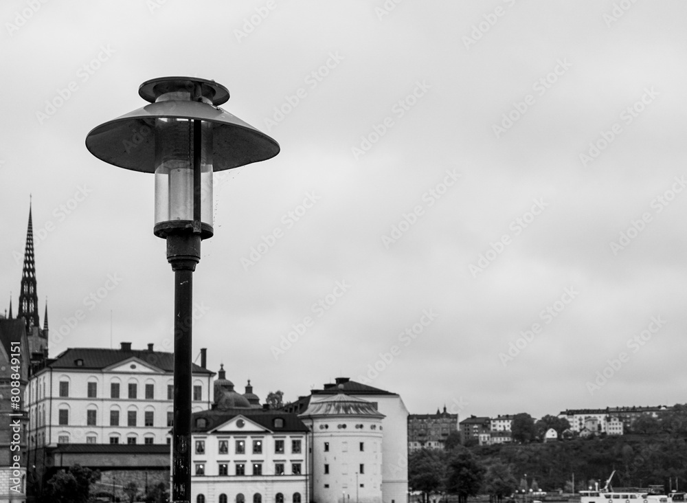 View of a lamp post in front of buildings