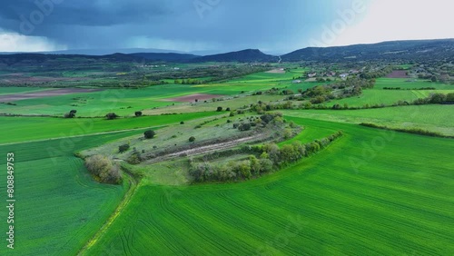 Green fields of cereals in spring in Lastras de las Heras, in the Losa Valley. Aerial view from a drone. Las Merindades region. Burgos, Castilla y Leon, Spain, Europe photo