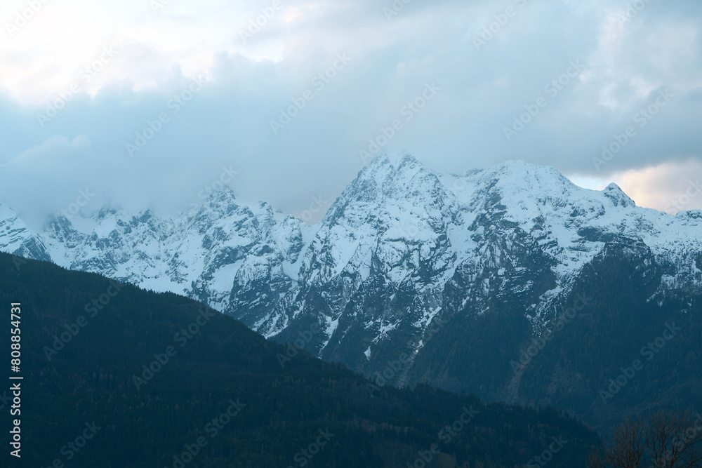 Tranquil Beauty: Cloud-Enshrouded Peaks in the Heart of the Alps