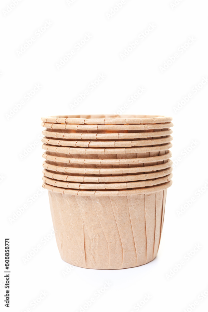 Stack of paper cupcake cups on white background Stack of paper cupcake cups on white background
