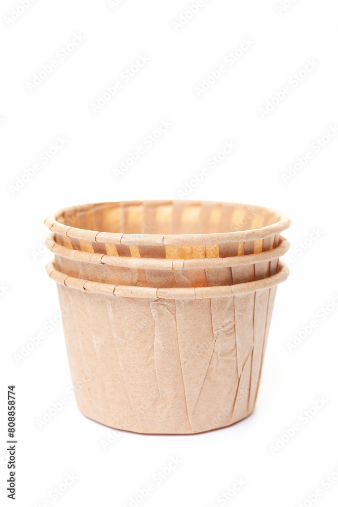 Stack of paper cupcake cups on white background Stack of paper cupcake cups on white background