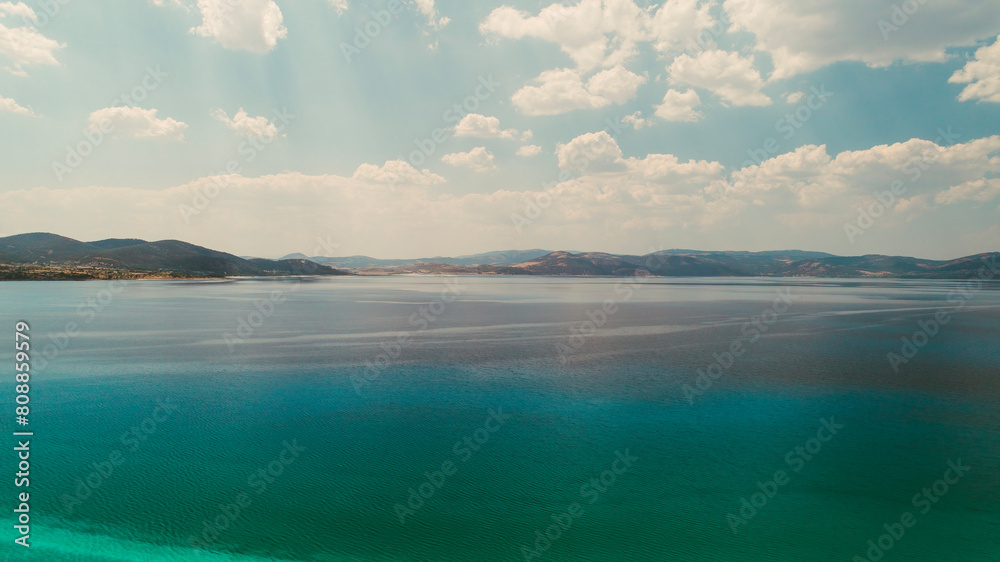 Obraz premium Magnificent nature view combined with the turquoise water of Salda Lake and magnificent clouds. Burdur, Turkey.