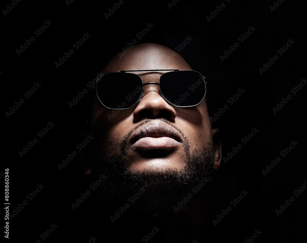 Φωτογραφία Thinking, black man and fashion with sunglasses in studio for trendy, stylish and serious as Musician on dark background
