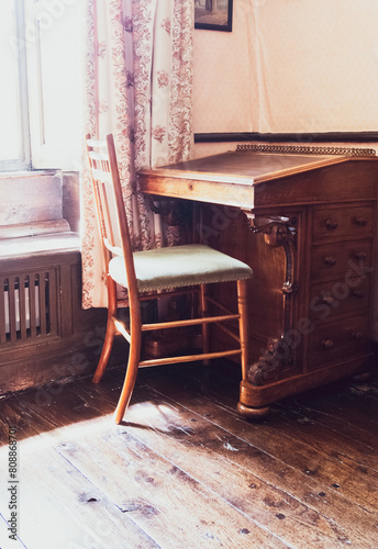 Vintage Simple Writing Desk & Chair In A Wooden Floor Room