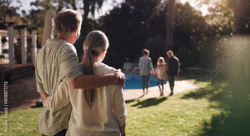 фотографія Senior couple, garden and hug from behind with family for good memories, growth and goodbye together in backyard