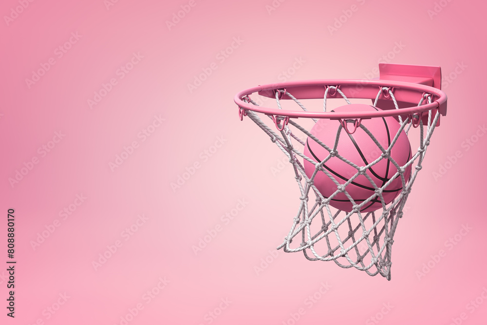Basketball falling into pink hoop