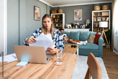 Career winner mindset. Young freelance businesswoman working at home. Confident dedicated female learning and educate herself for better opportunity in her business career, work on laptop computer.