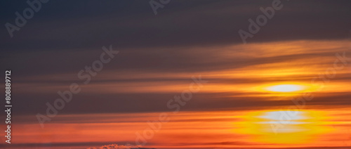 Beautiful dramatic orange sunset sky with clouds. Nature sky  background. © Inga Av