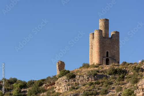 Torre de los Alarconcillos in Alarcon, Cuenca, against a clear blue sky photo