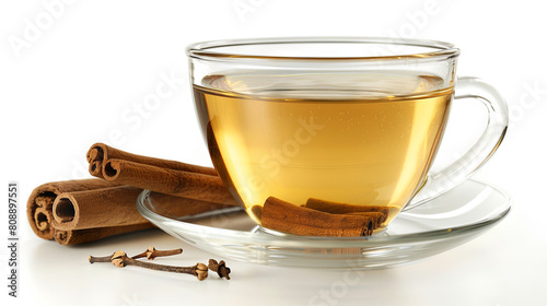 Glass cup of green tea with cinnamon sticks