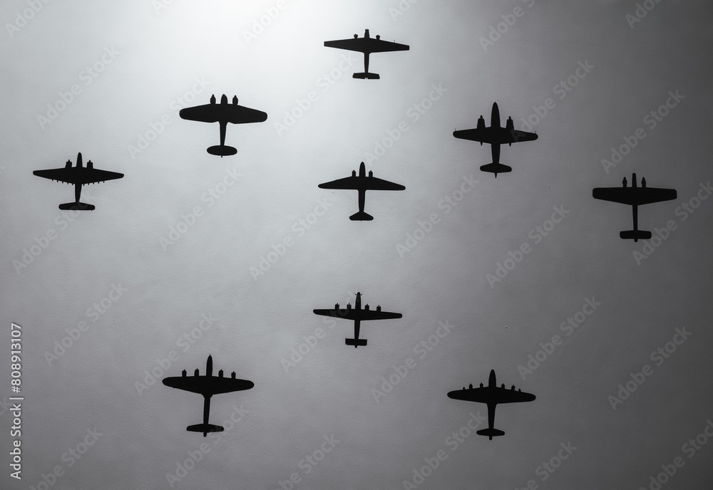 Fototapete Silhouettes of Airplanes in Formation.