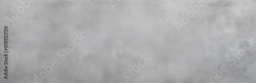 Panoramic image of a seamless, smooth gray concrete texture, perfect for backgrounds or as a design element for creative projects, with a minimalist industrial feel