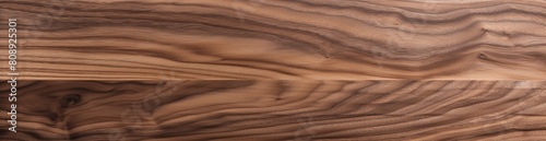 High-resolution image featuring the natural patterns of walnut wood, perfect for a luxurious and organic background or a detailed visual representation of wood grain in design projects
