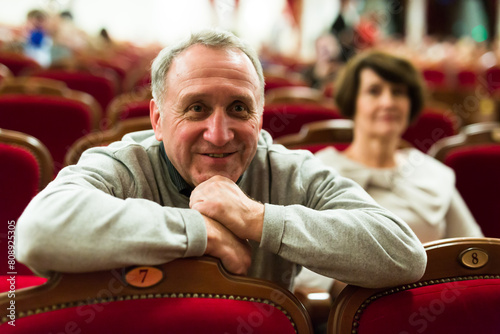 Mature man in theater watching a performance