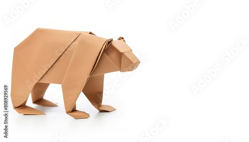 Animal concept paper origami isolated on white background of a grizzly bear - Ursus arctos horribilis - with copy space side view, simple starter craft for kids photo