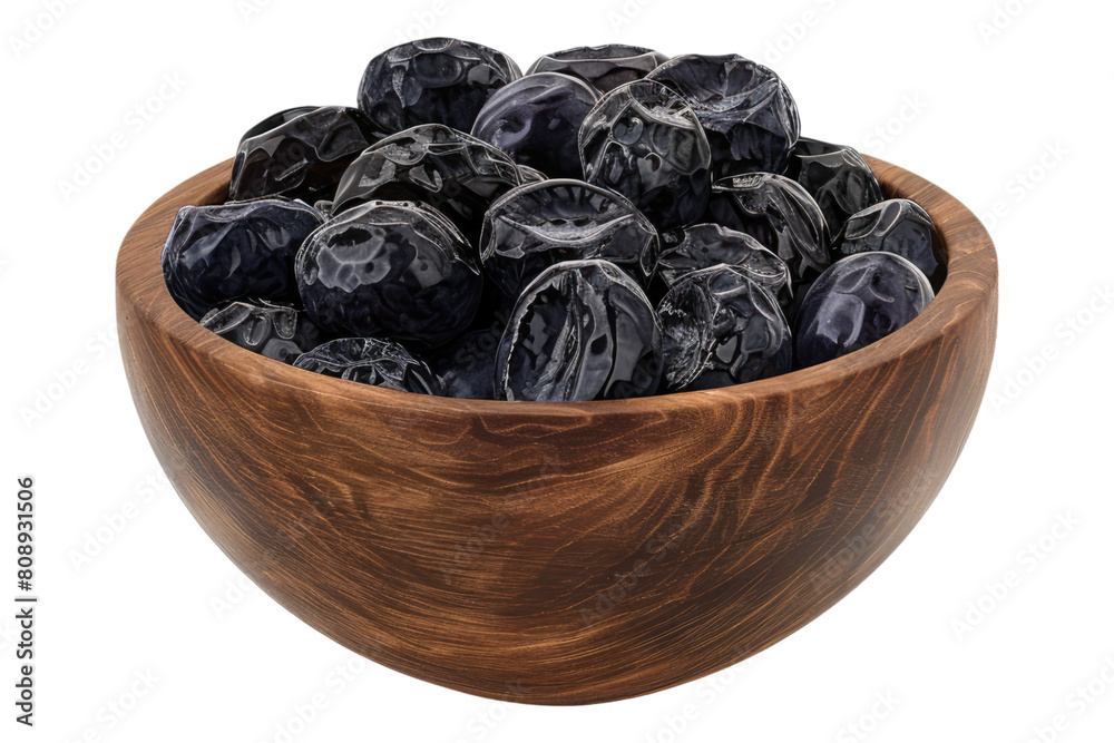 Prunes in a wooden bowl Isolated on transparent background Prunes in a wooden bowl Isolated on transparent background