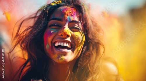 Young Indian woman joyfully laughing with Holi colors © Photocreo Bednarek