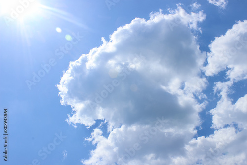 blue sky refreshing scene with cloud and lens flare