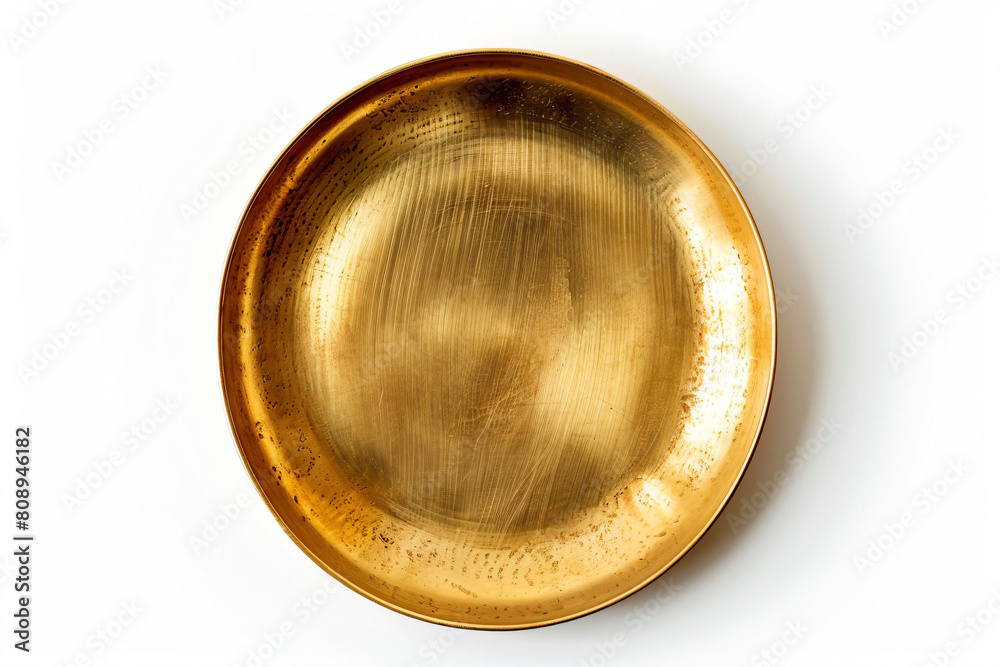 a gold plate on a white surface a gold plate on a white surface