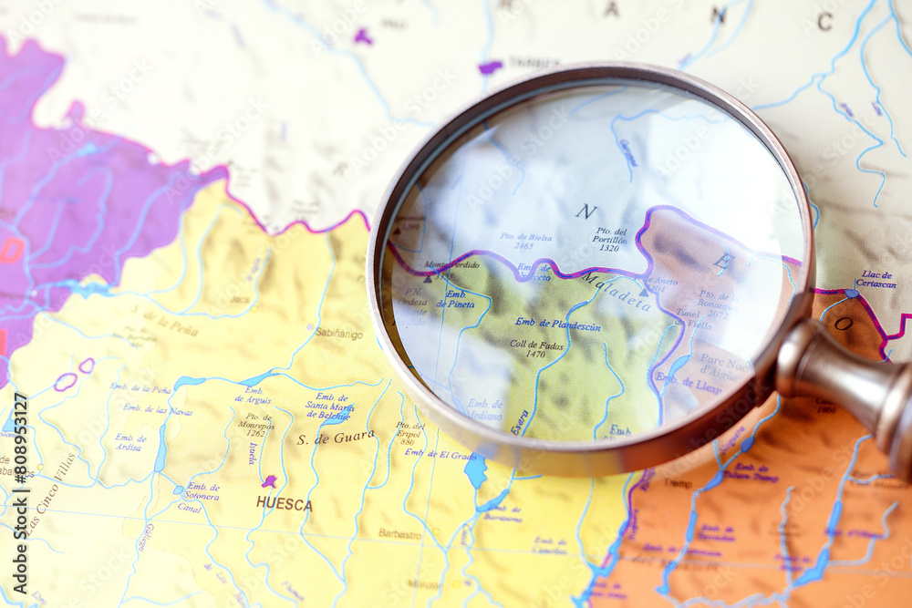Magnifying glass on a map. Magnifying glass over a map. Travel Concept Magnifying glass on a map. Magnifying glass over a map. Travel Concept