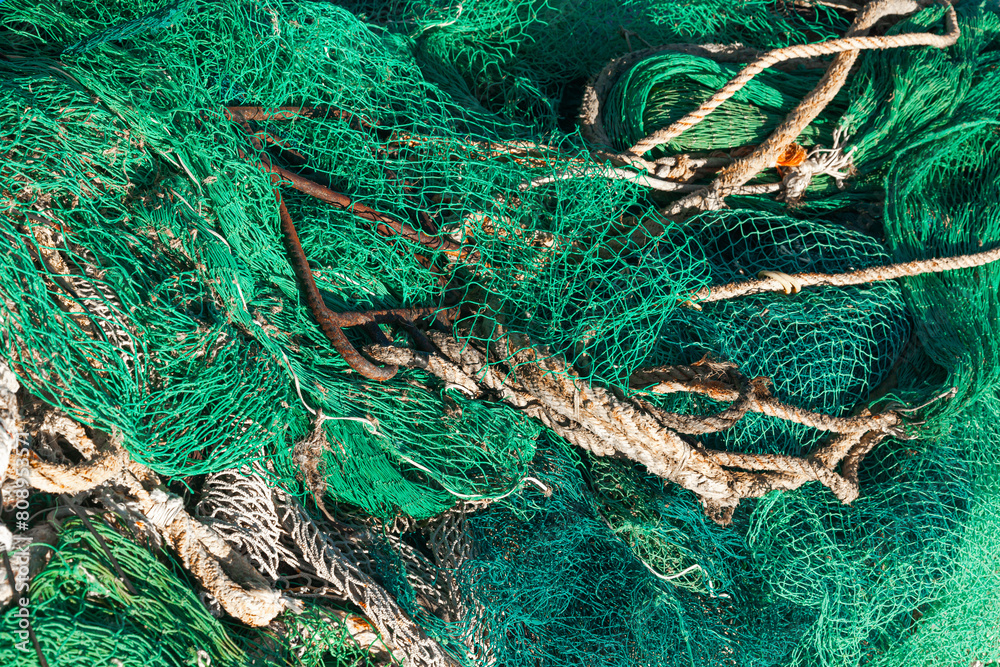 A pile of fishing nets to dry, close-up. A pile of fishing nets to dry, close-up.