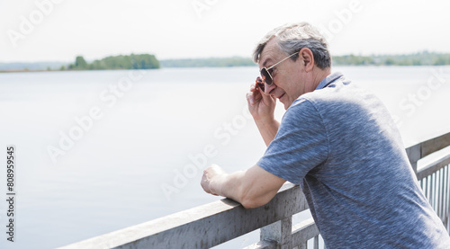 Mature European man with a good mood, outdoor portrait. The concept of life after 50 years	