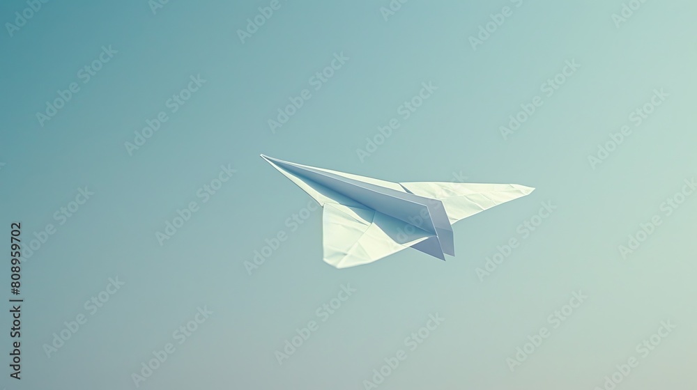 A single paper airplane flying against a clear sky. A single paper airplane flying against a clear sky.