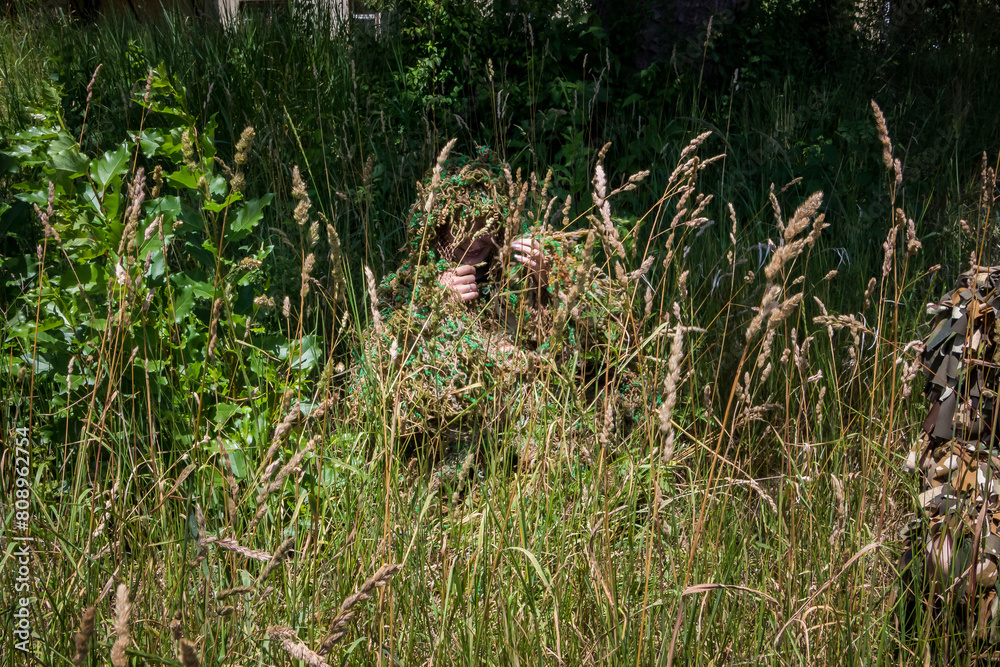 volunteer woman in a camouflage suit made of multi-colored threads, handmade, help to the military, Ukraine
volunteer woman in a camouflage suit made of multi-colored threads, handmade, help to the military, Ukraine