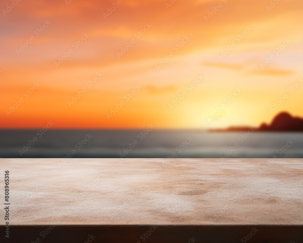 An empty table with a blurred sunset and ocean in the background. An empty table with a blurred sunset and ocean in the background.